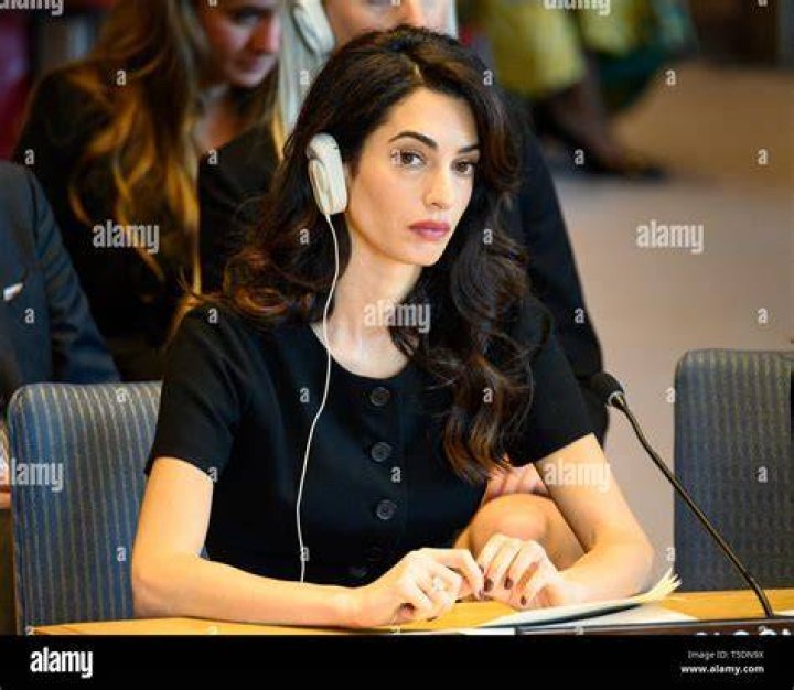 Amal Clooney's pregnancy chic wife shows off her baby bump in
