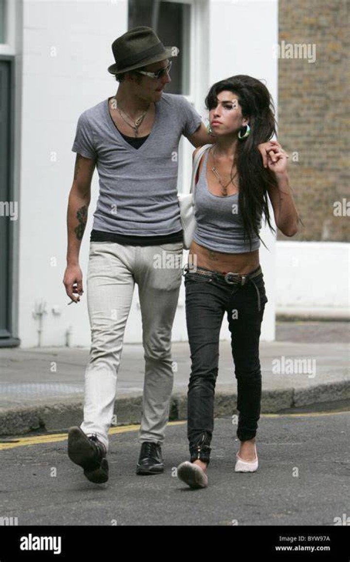 Amy Winehouse and husband Blake FielderCivil leave home to go for