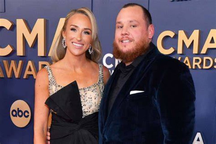 Luke Combs + Wife Nicole Ravish in Red on the 2023 CMAs Carpet